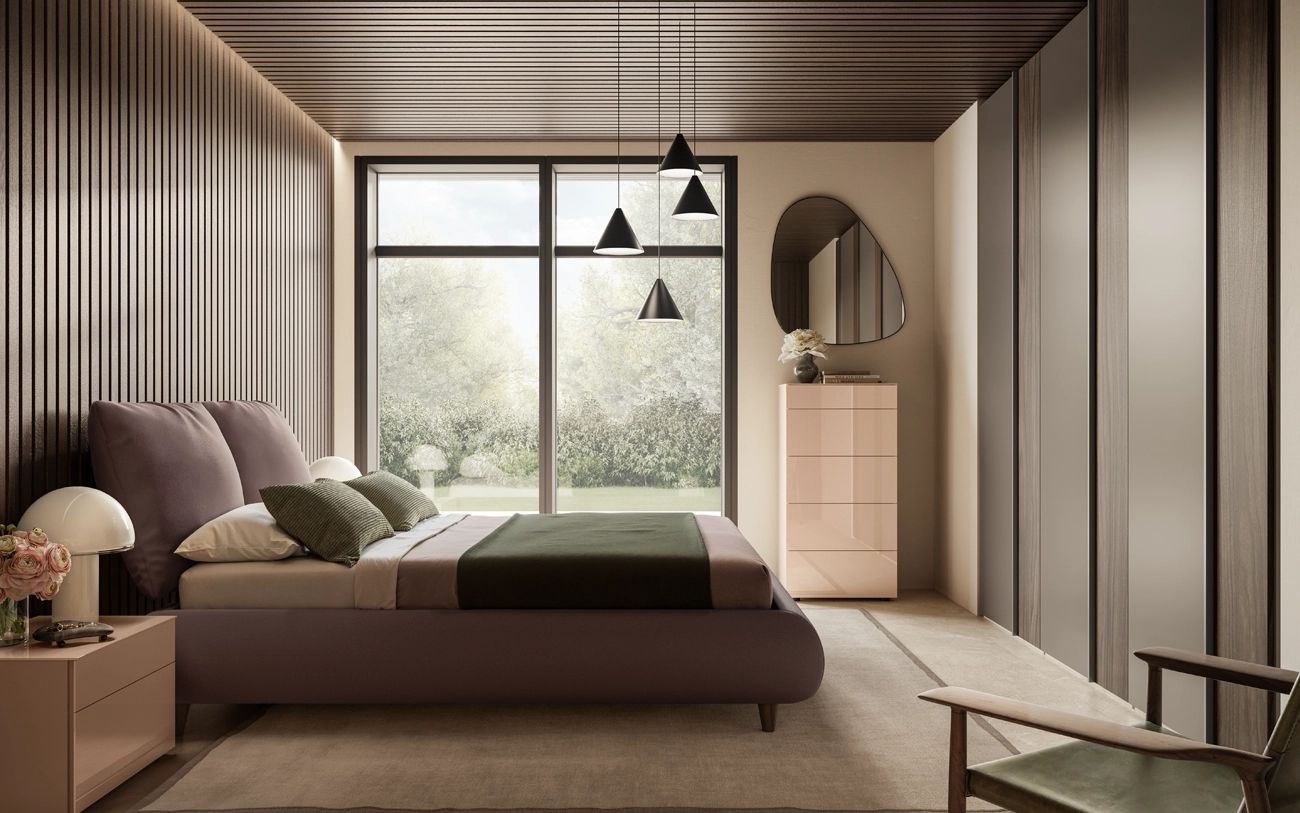 Immagine camera matrimoniale con letto con grandi cuscini in tessuto armadio battente grigio seta e noce moro