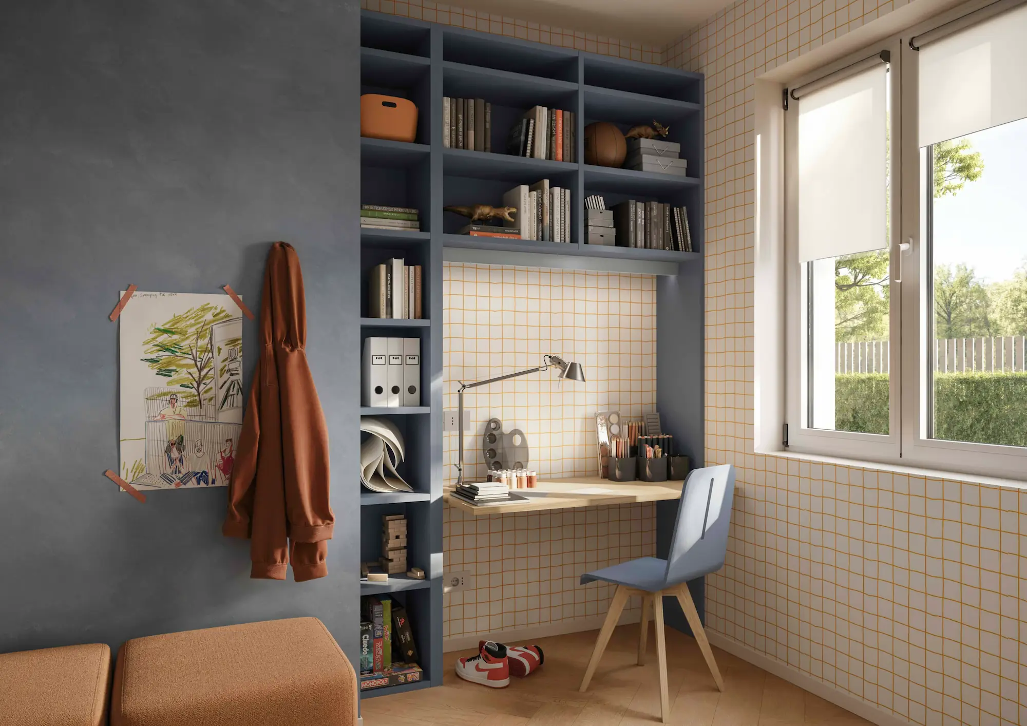 Angolo studio della cameretta del ragazzo con libreria a ponte, scrivania e materiale da disegno